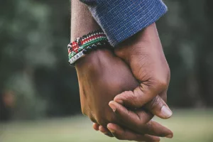 two hands holding each other
